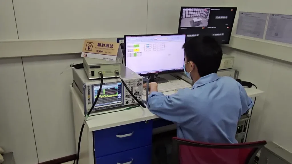 Engineer testing medical power supply performance and reliability in an IEC 60601 1 compliance laboratory